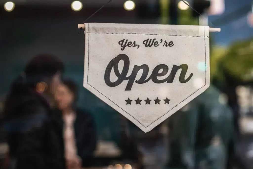 Small Business in a small city with Yes We're Open sign.